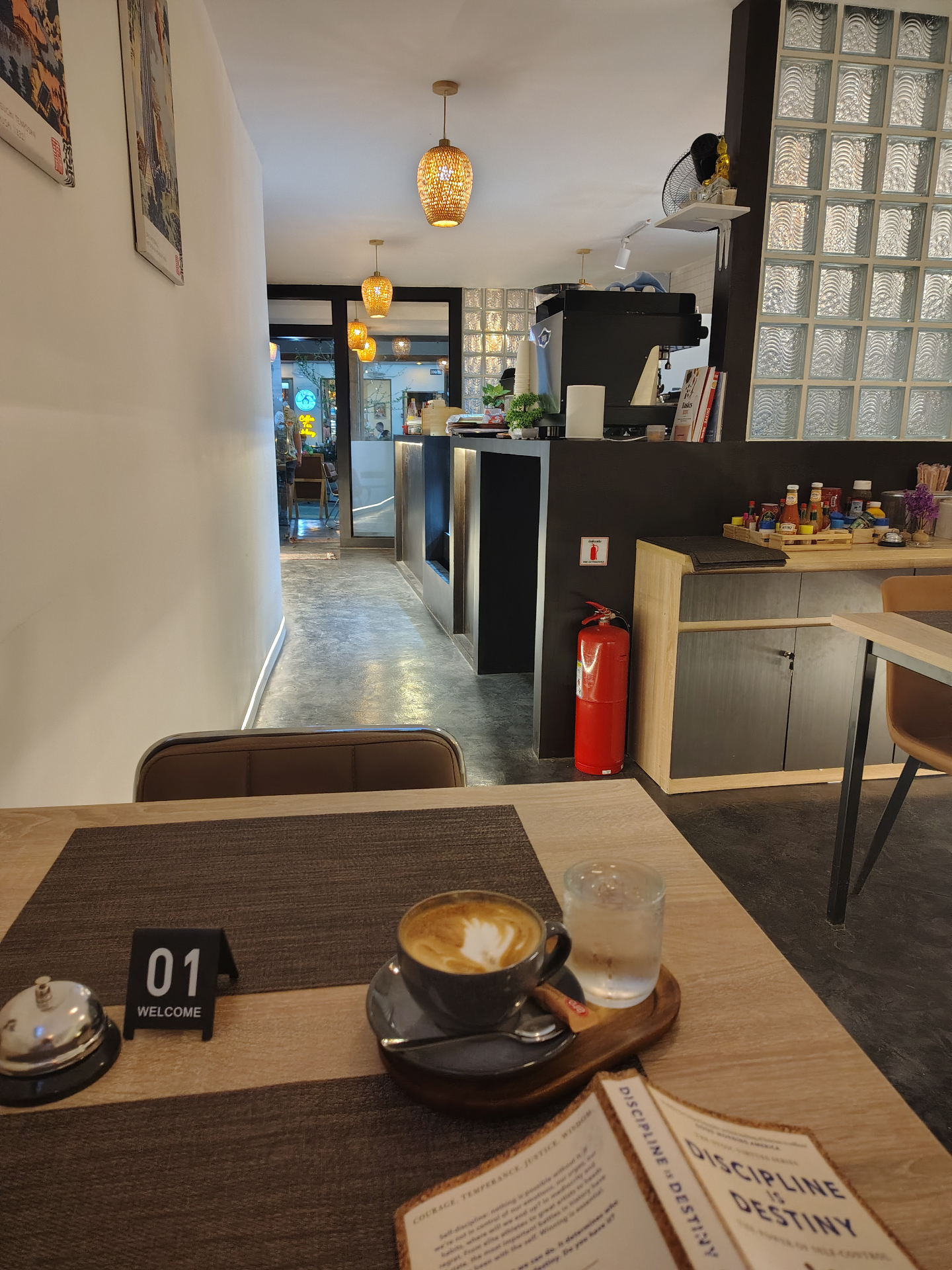 Inside a hospitality café showing service counter and dining area