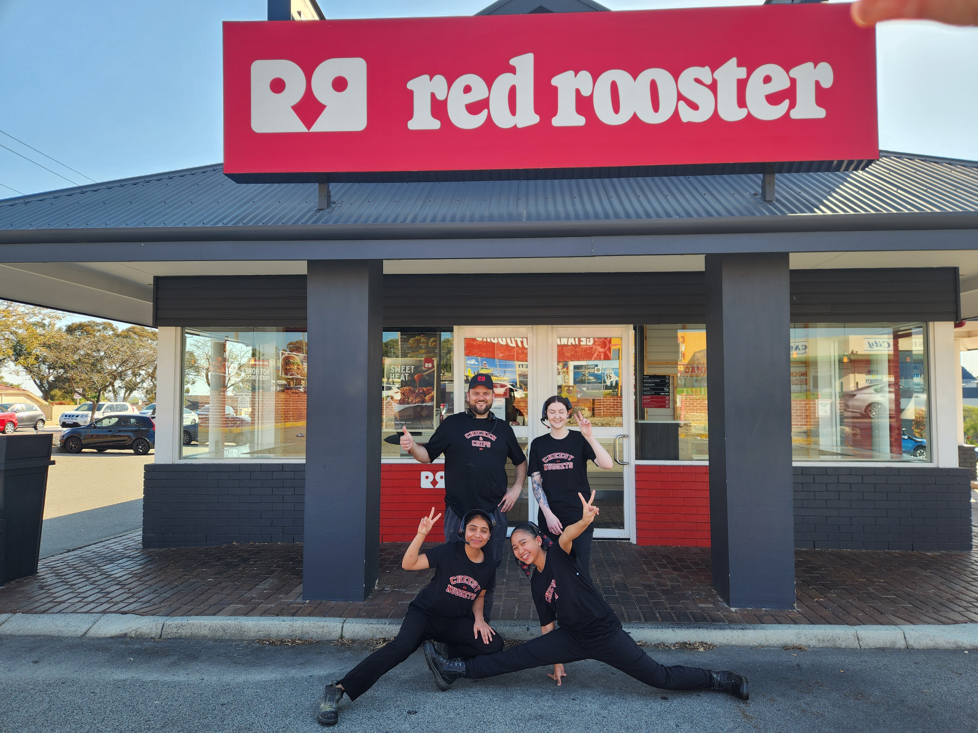 Franchise team in front of their store